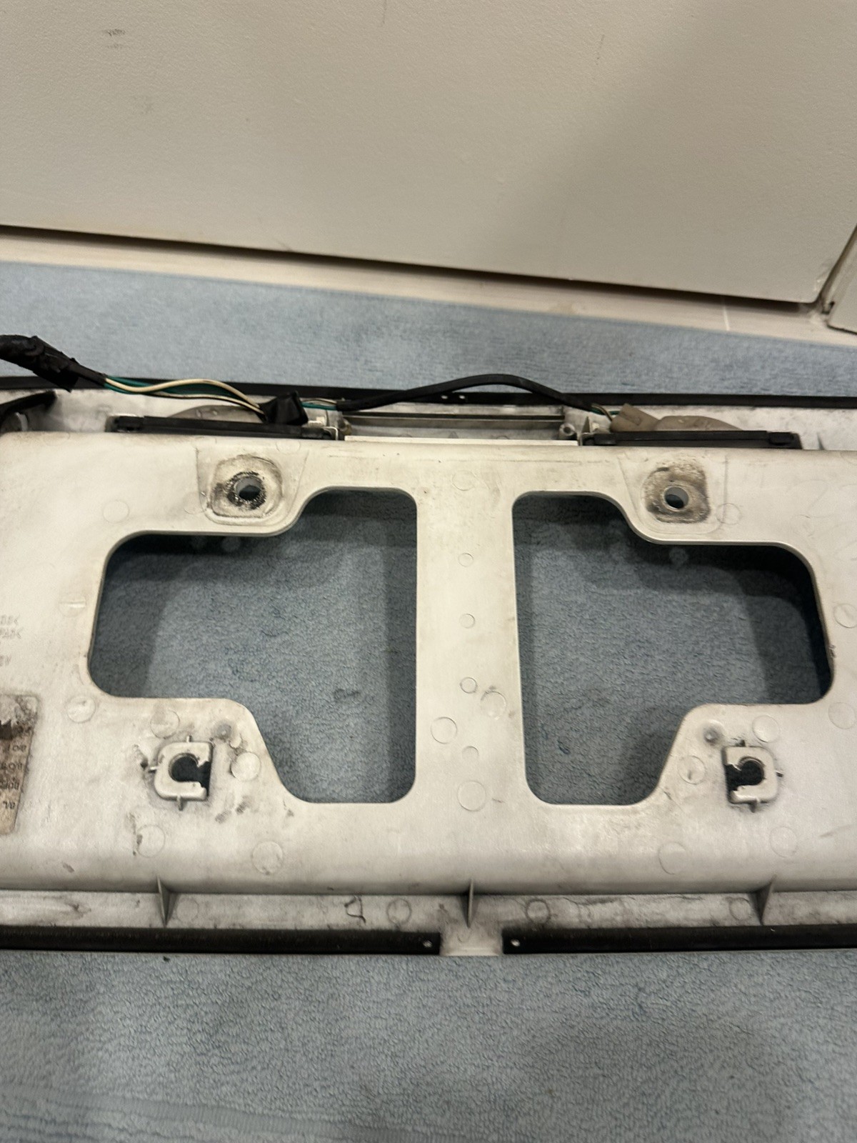 2001 – 2007 Toyota Sequoia Rear Lift Gate Hatch License Plate Trim White OEM