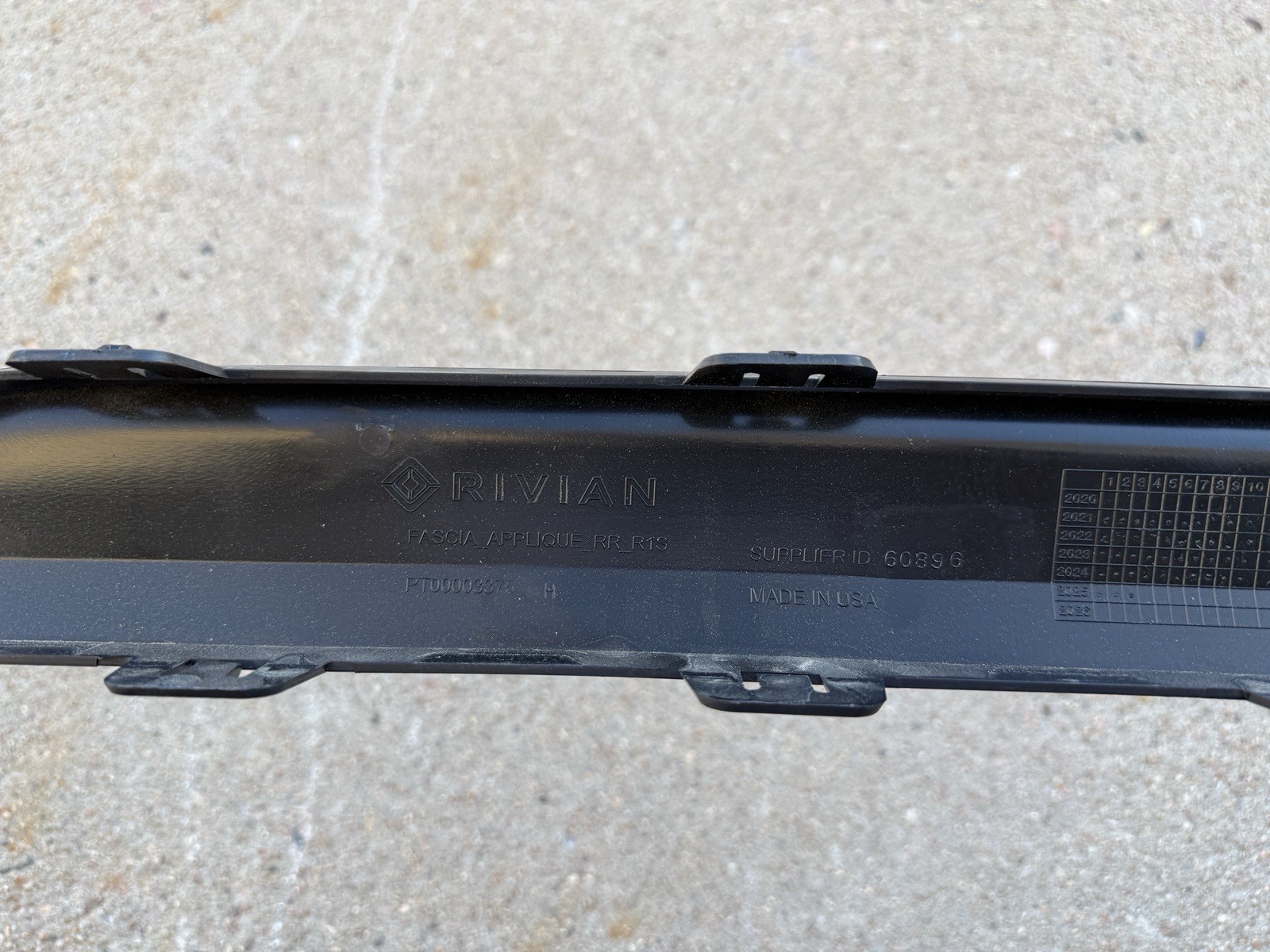 2022-2025 Rivian R1S Rear Bumper Center Moulding Gunmetal Finish Strip Trim OEM