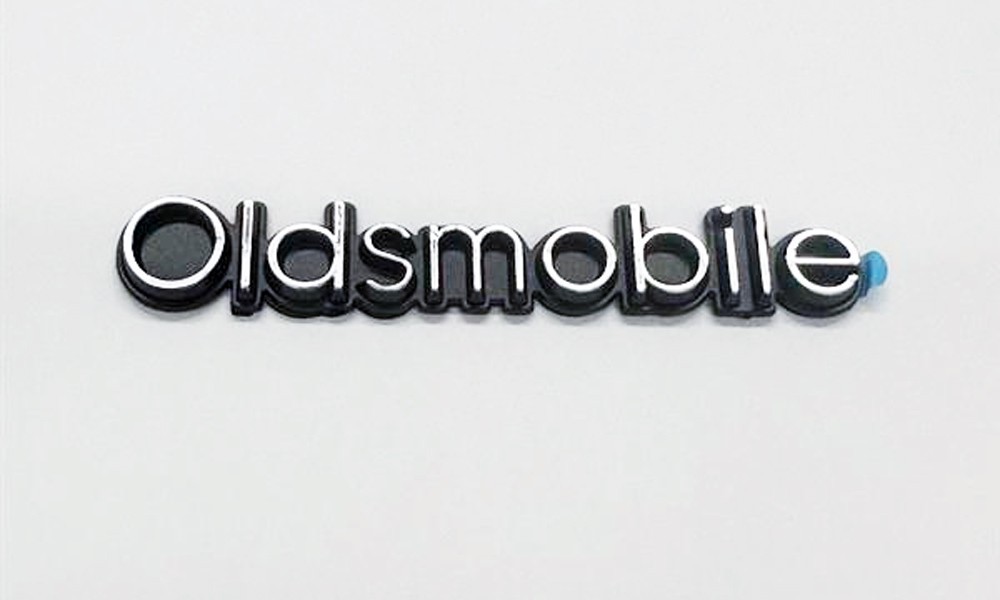 1978-80 Cutlass “OLDSMOBILE” Header Panel Emblem Adhesive Backed GM part #555744