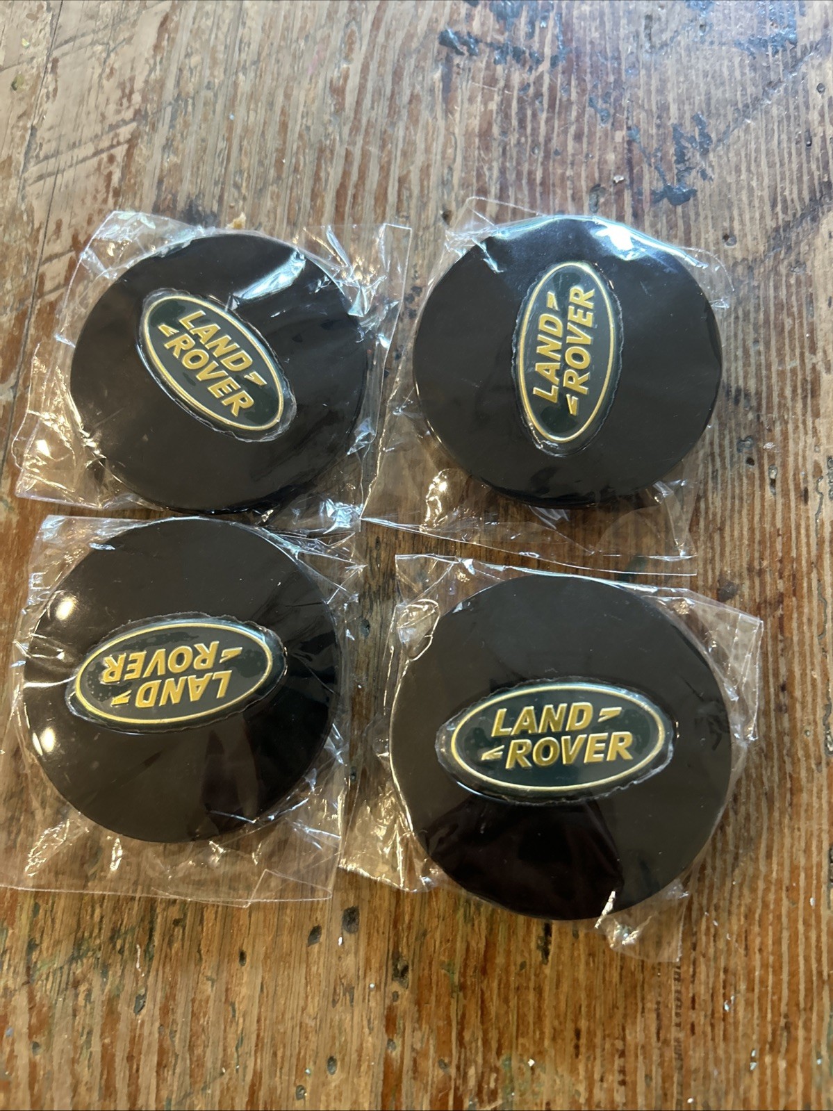 Land Rover 63mm Black Wheel Center Caps with Green Gold Emblem (4)
